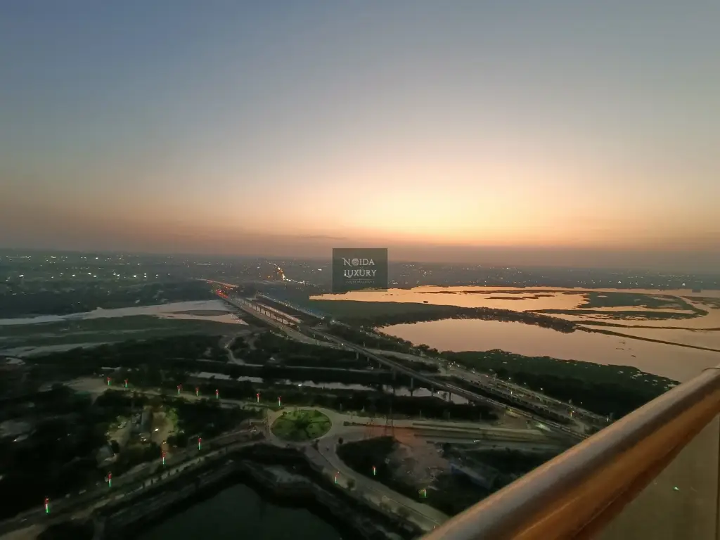 Sunset river and city view from penthouse balcony at Nova Residences Supertech Supernova Noida