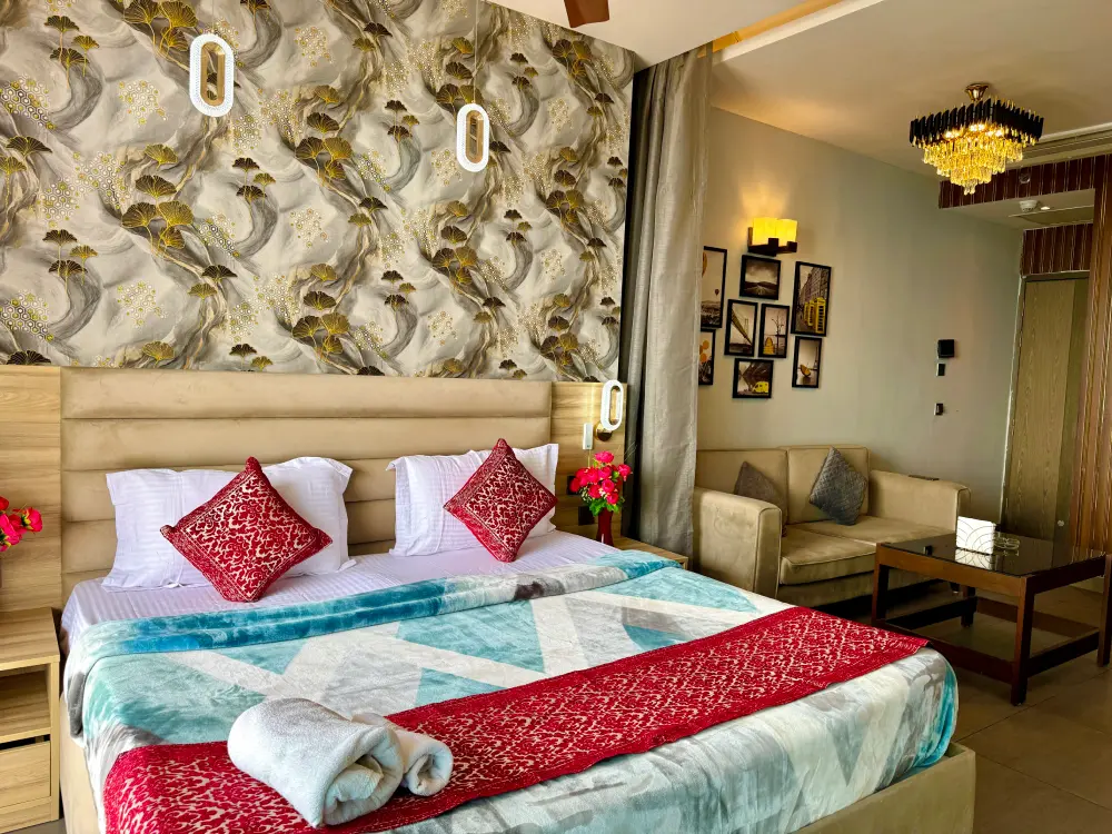 Red-themed bedroom at Mulberry Homes Supernova Noida